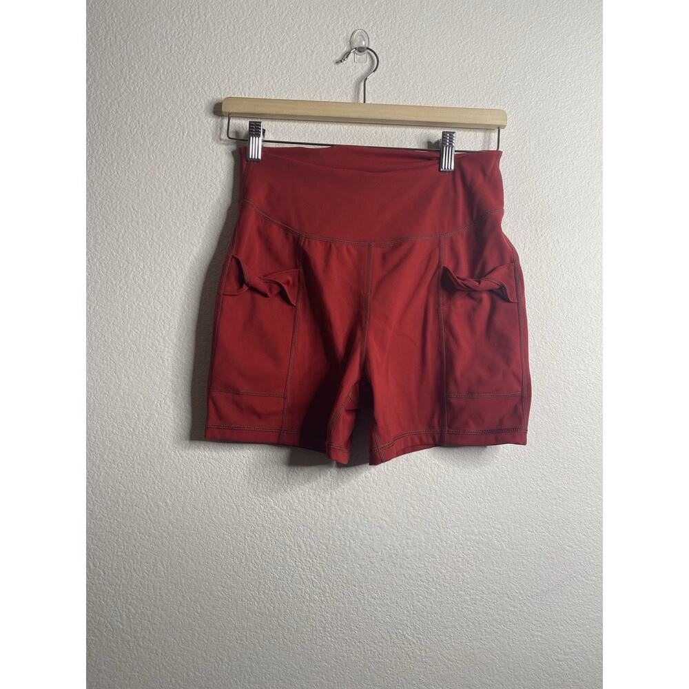 Free People Movement Wave Rider Shorts in the color Brick Merlot Red Medium - Picture 2 of 5